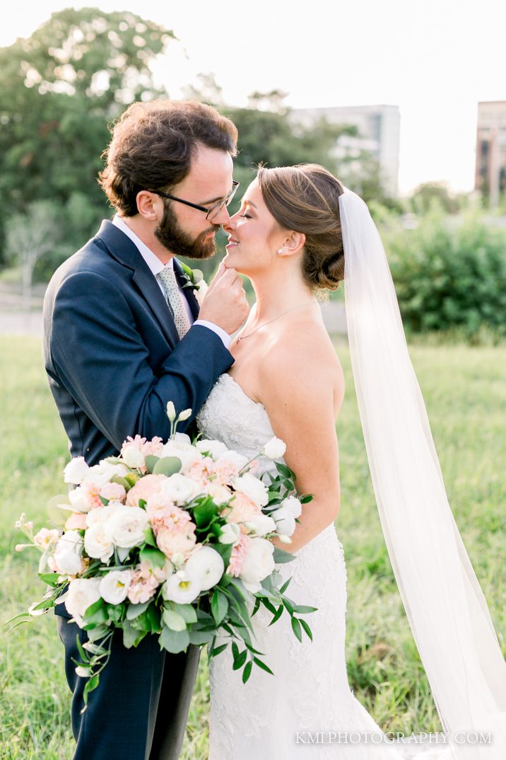 a newlywed couple poses for photos in Wilmington NC