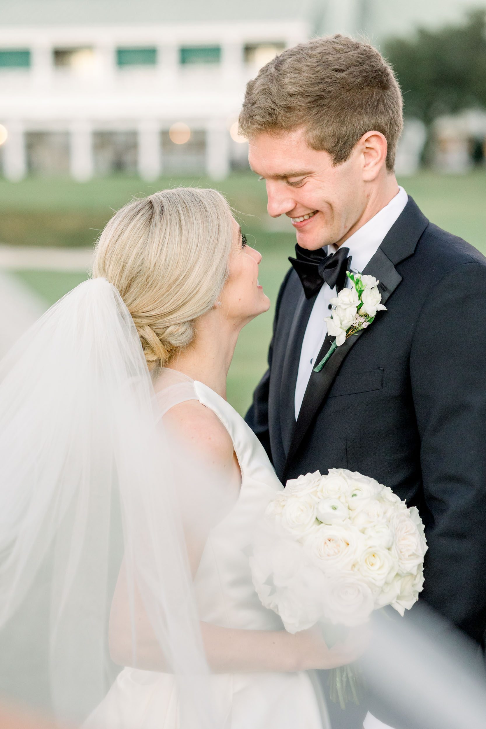 a bride and groom embrace at their southport nc wedding