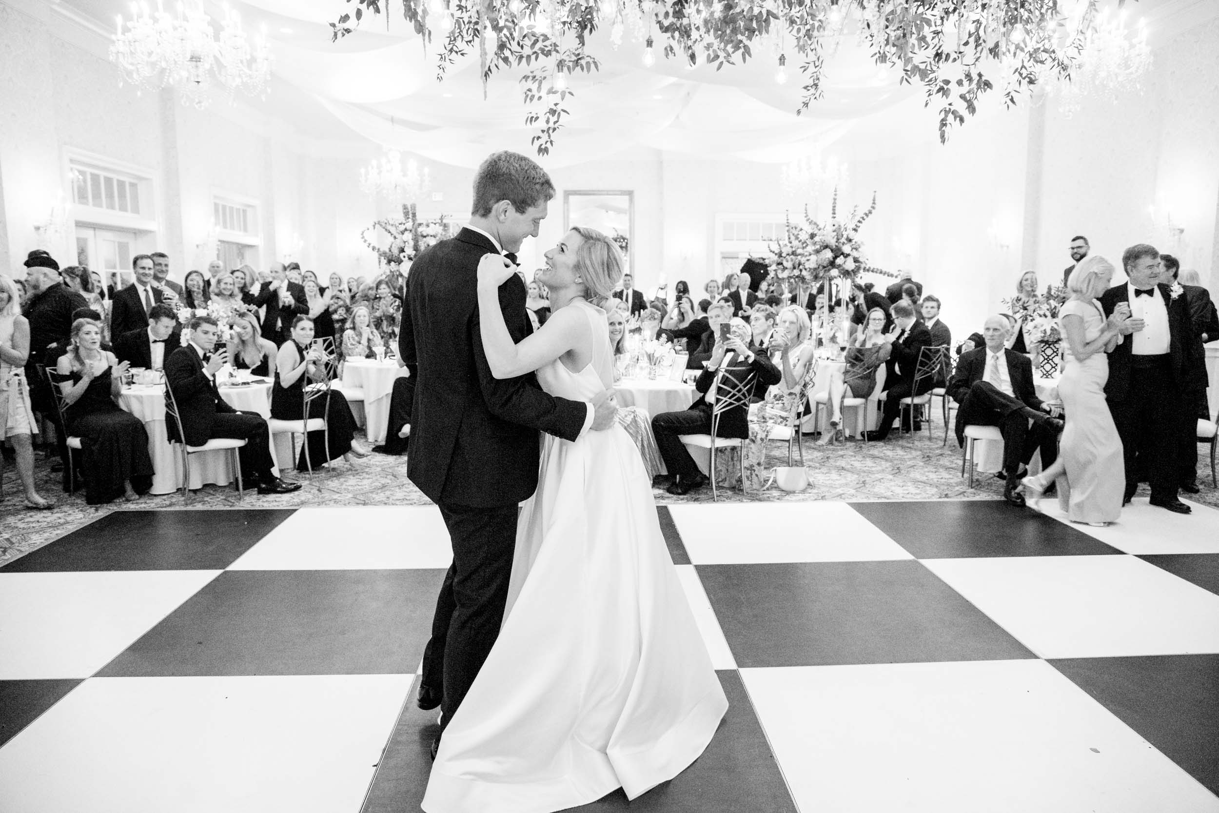 Bride and groom dancing during their reception at Cape Fear Country Club, photographed by Cape Fear Country Club wedding photographers.