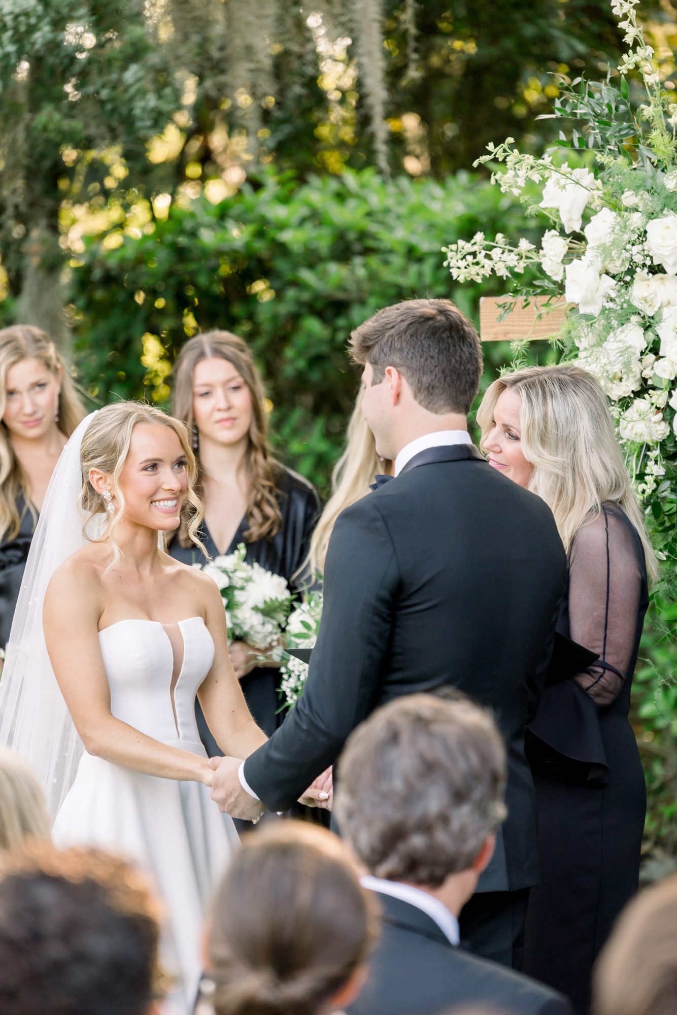 a bride and groom exchange vows at their wedding in Wilmington NC