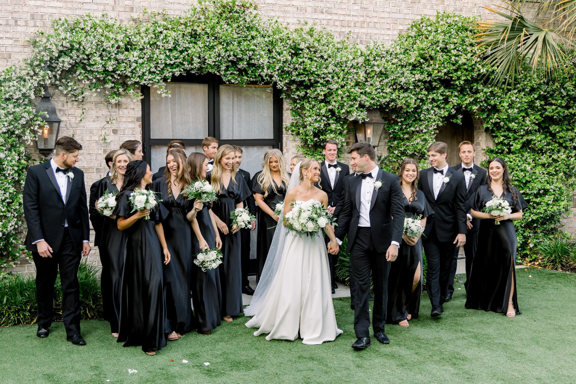 a wedding party celebrates their the bride and groom at wrightsville manor 