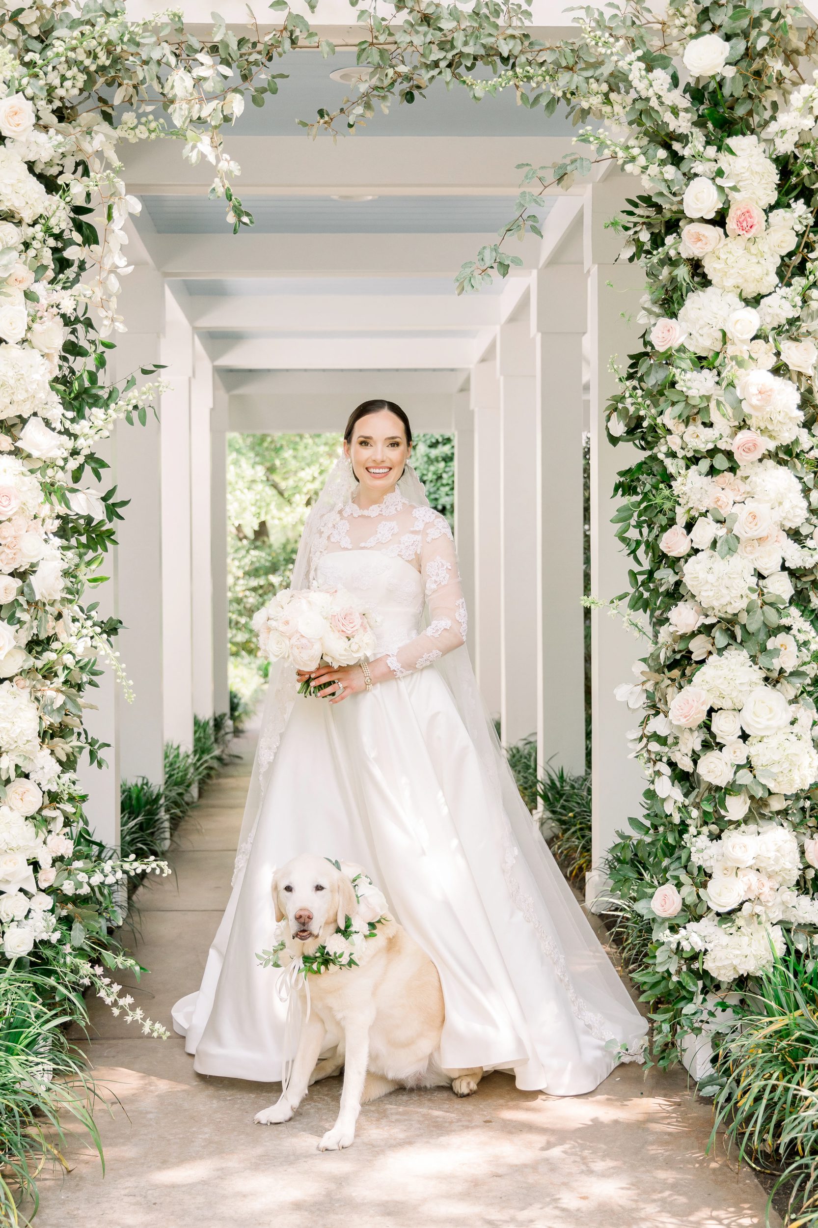 Bride in lace ballgown posing on the grounds at Sycamore Bend in Wilmington NC
