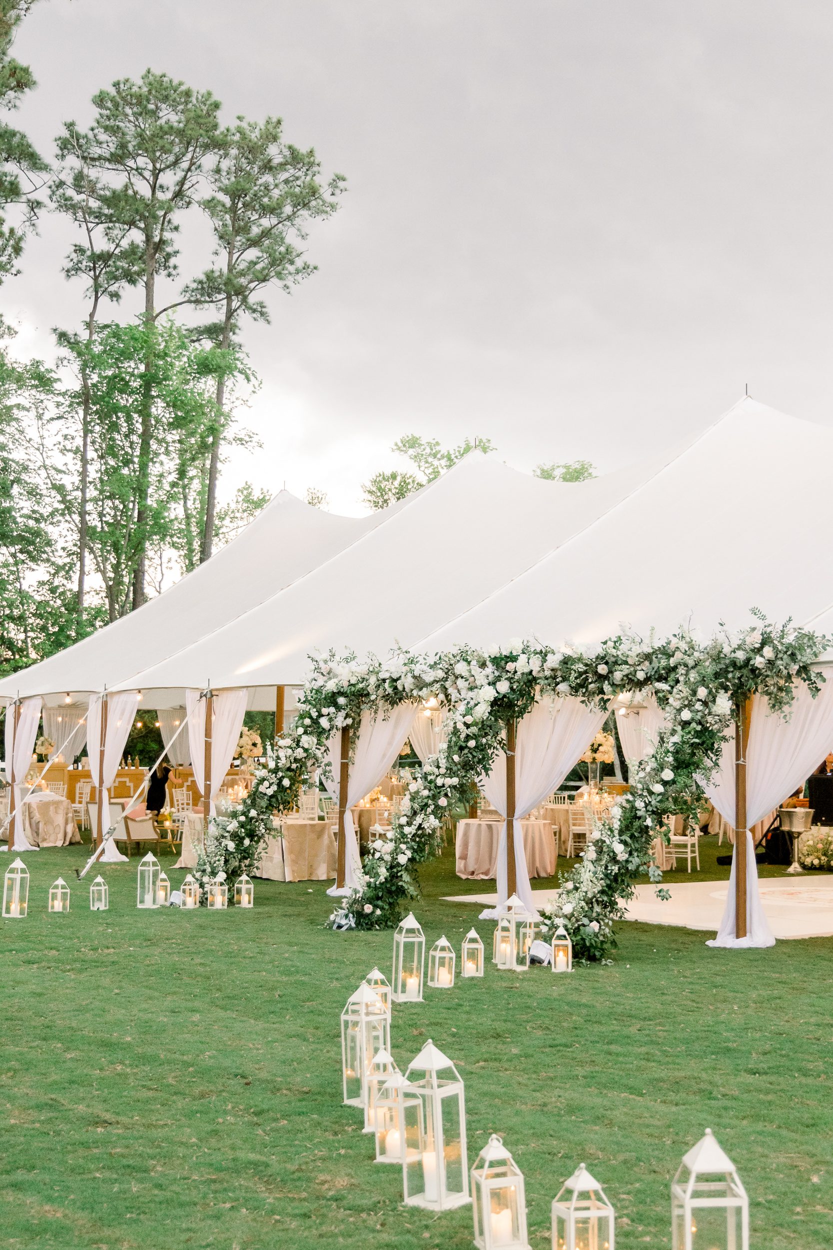 Tented reception with florals and candlelight at Sycamore Bend in Wilmington NC