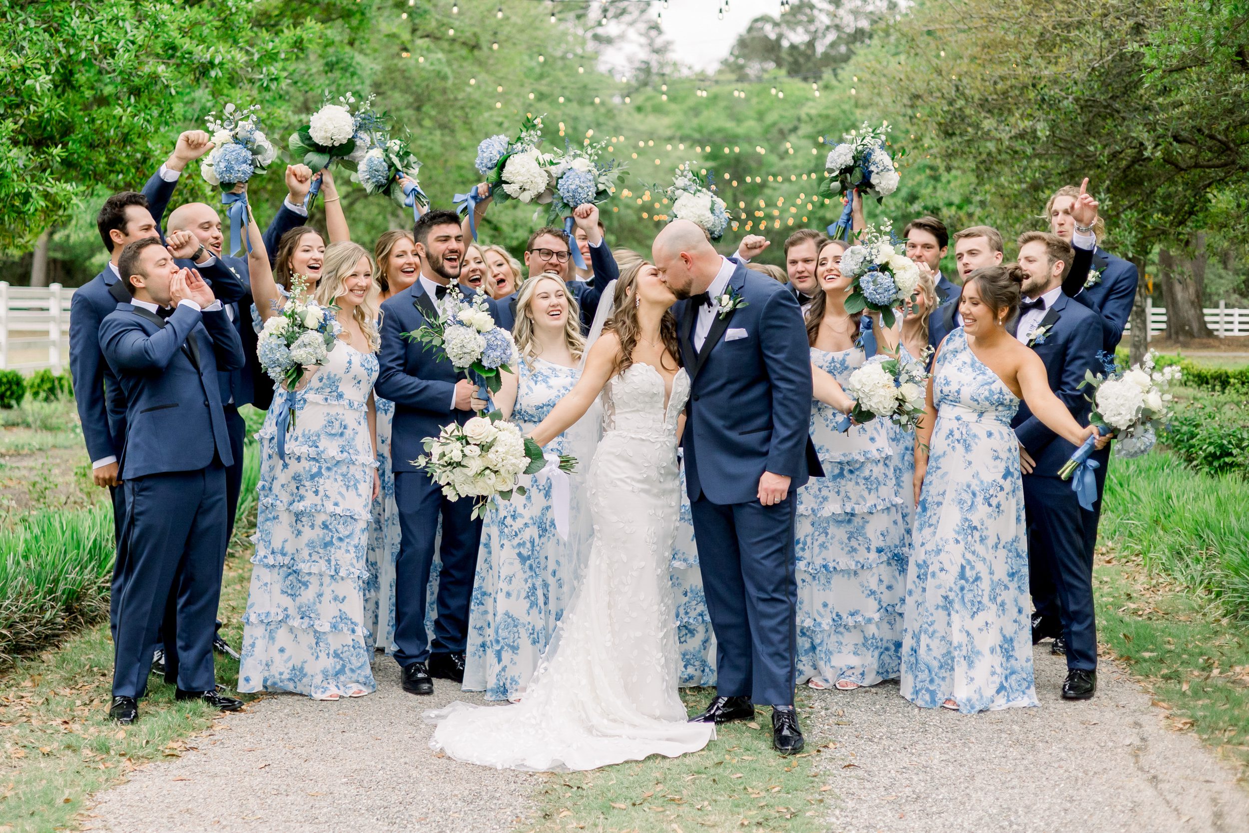 Wedding party celebrating with the bride and groom at Sycamore Bend Estate in Wilmington NC