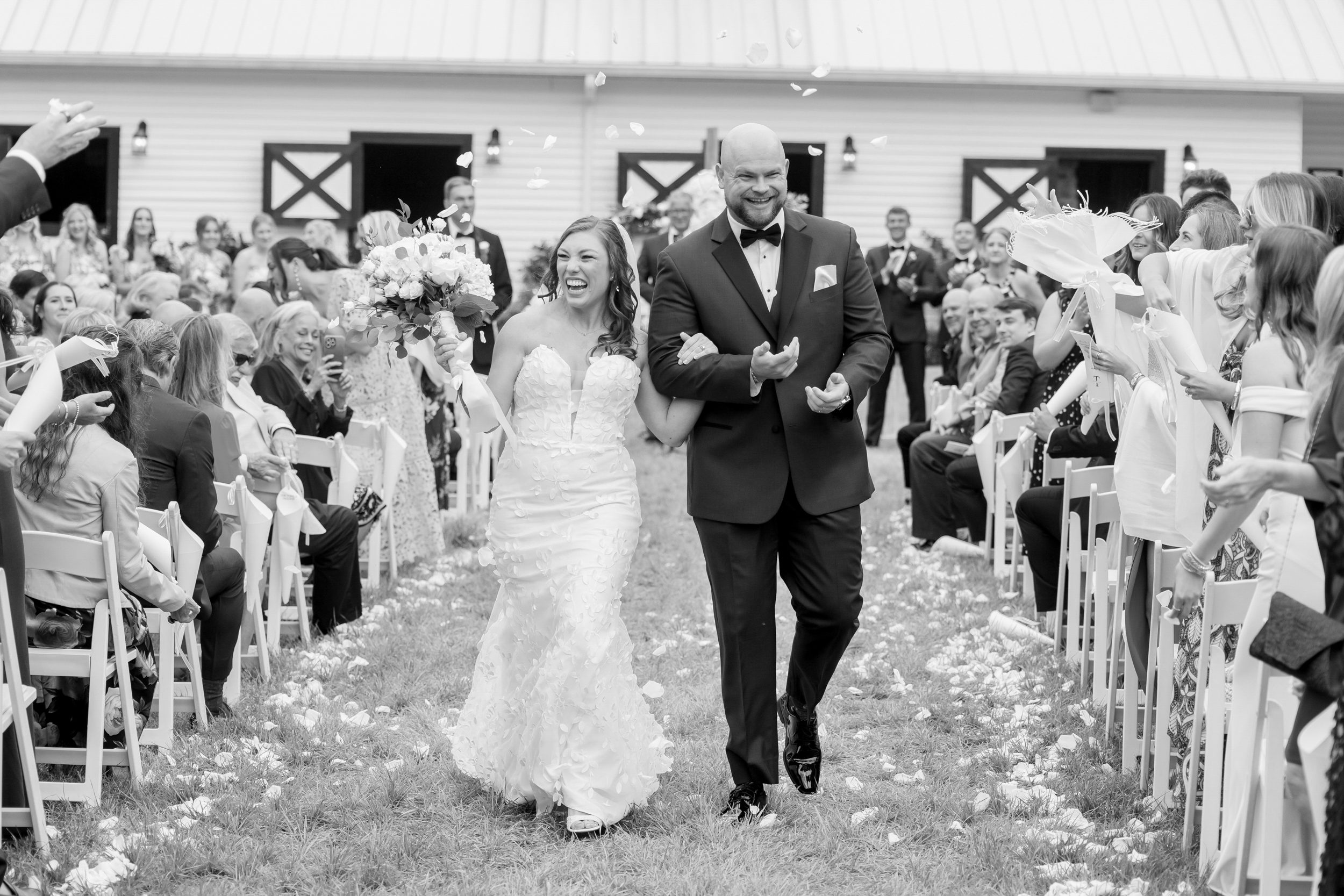 Bride and groom walking up the aisle after their ceremony in Wilmington NC