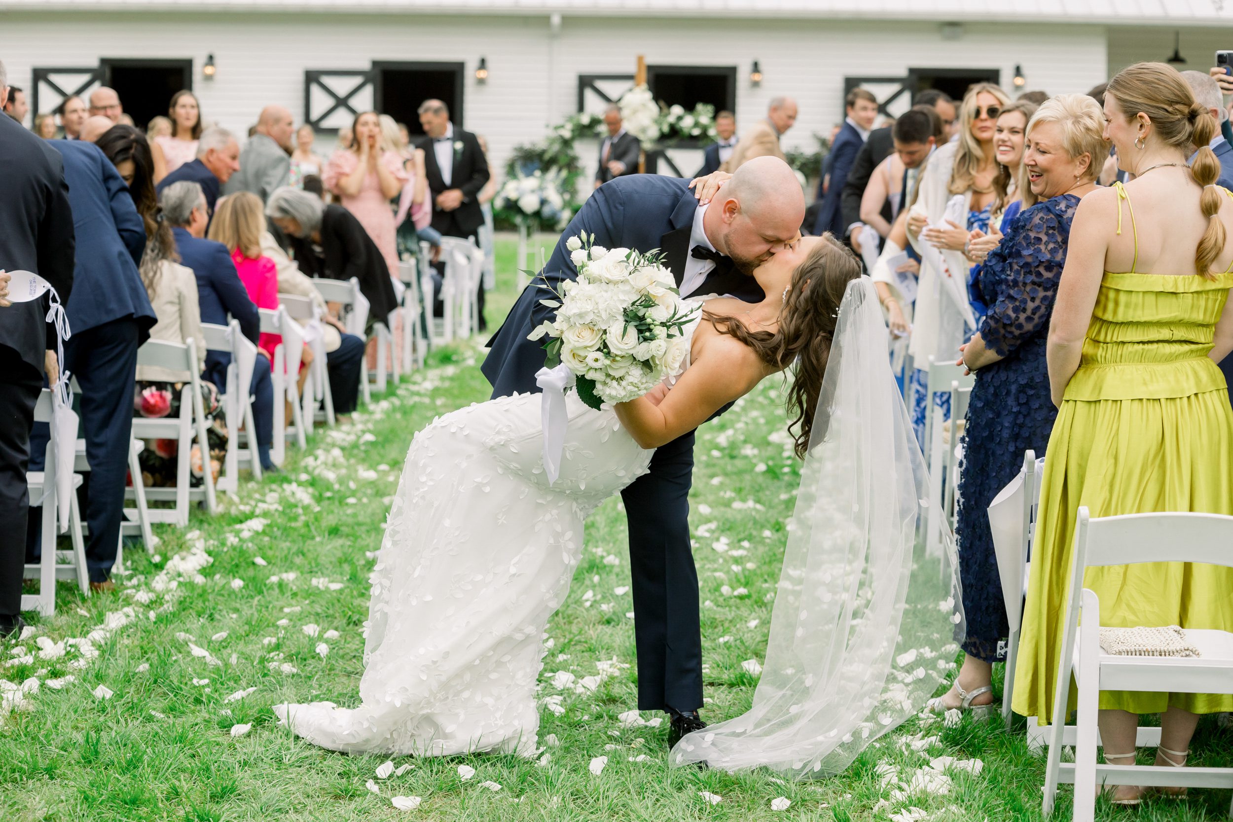 Bride and groom share a kiss after their ceremony at Sycamore Bend Estate in Wilmington NC