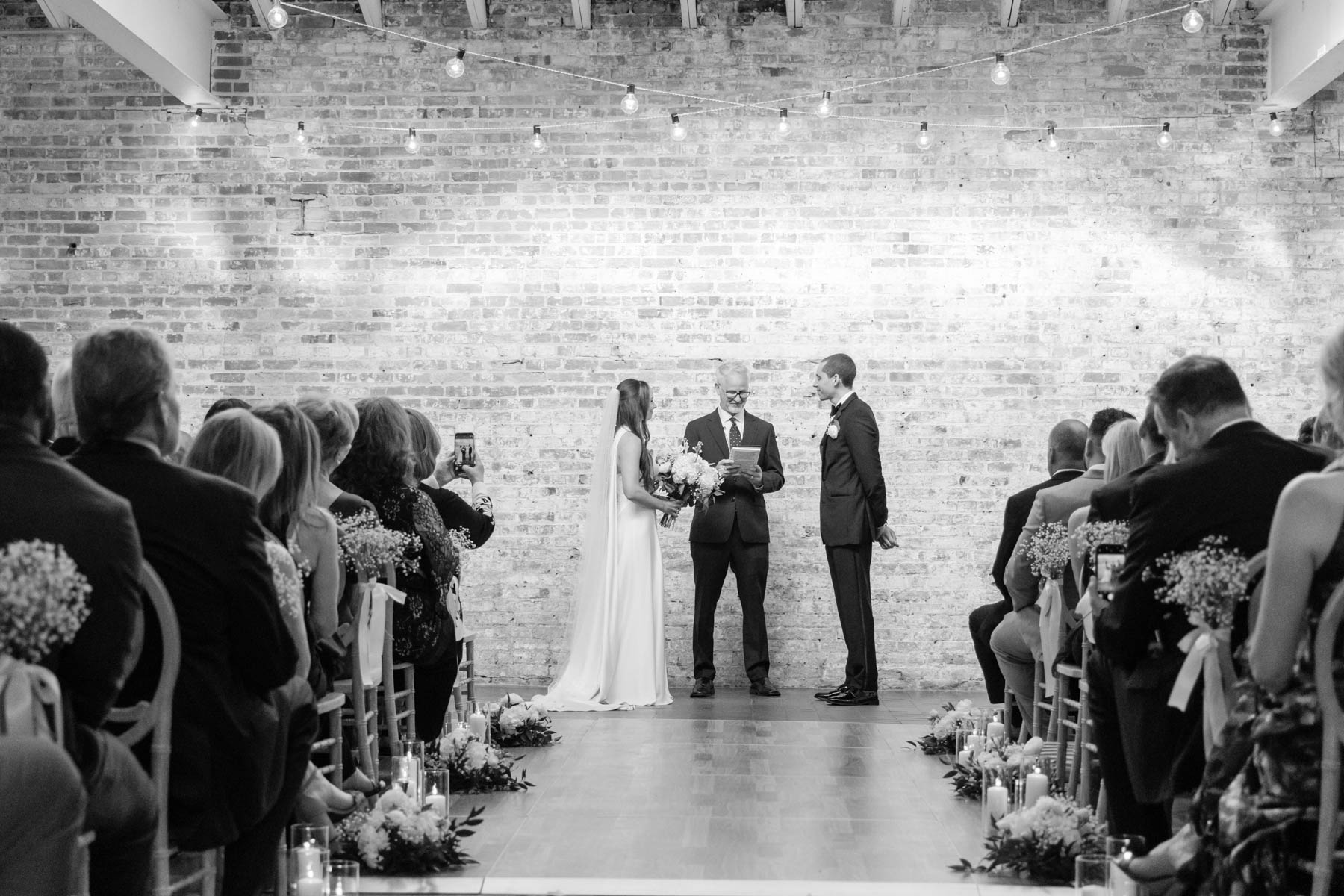 Indoor wedding ceremony at Bakery 105, one of the best downtown Wilmington NC wedding venues