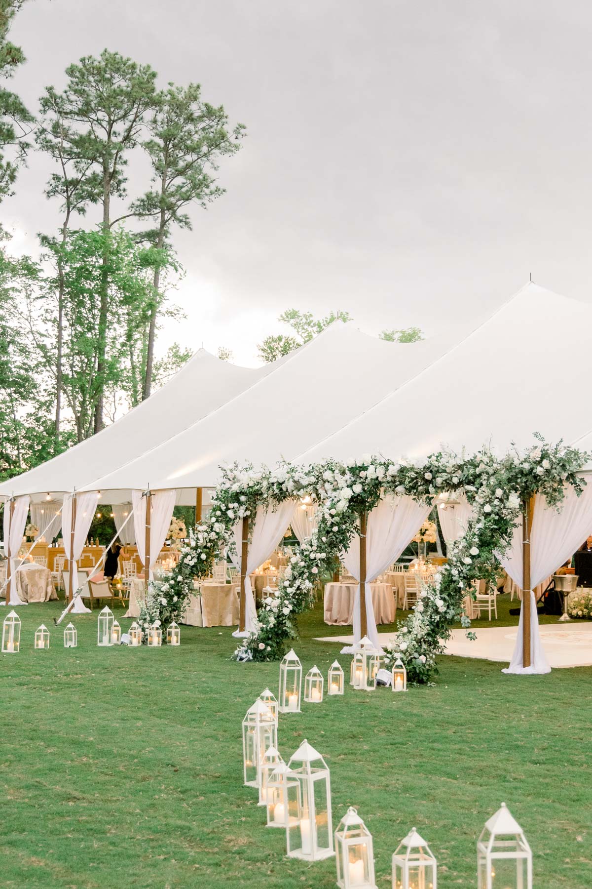 Outdoor tented wedding reception at Sycamore Bend Estate surrounded by gardens