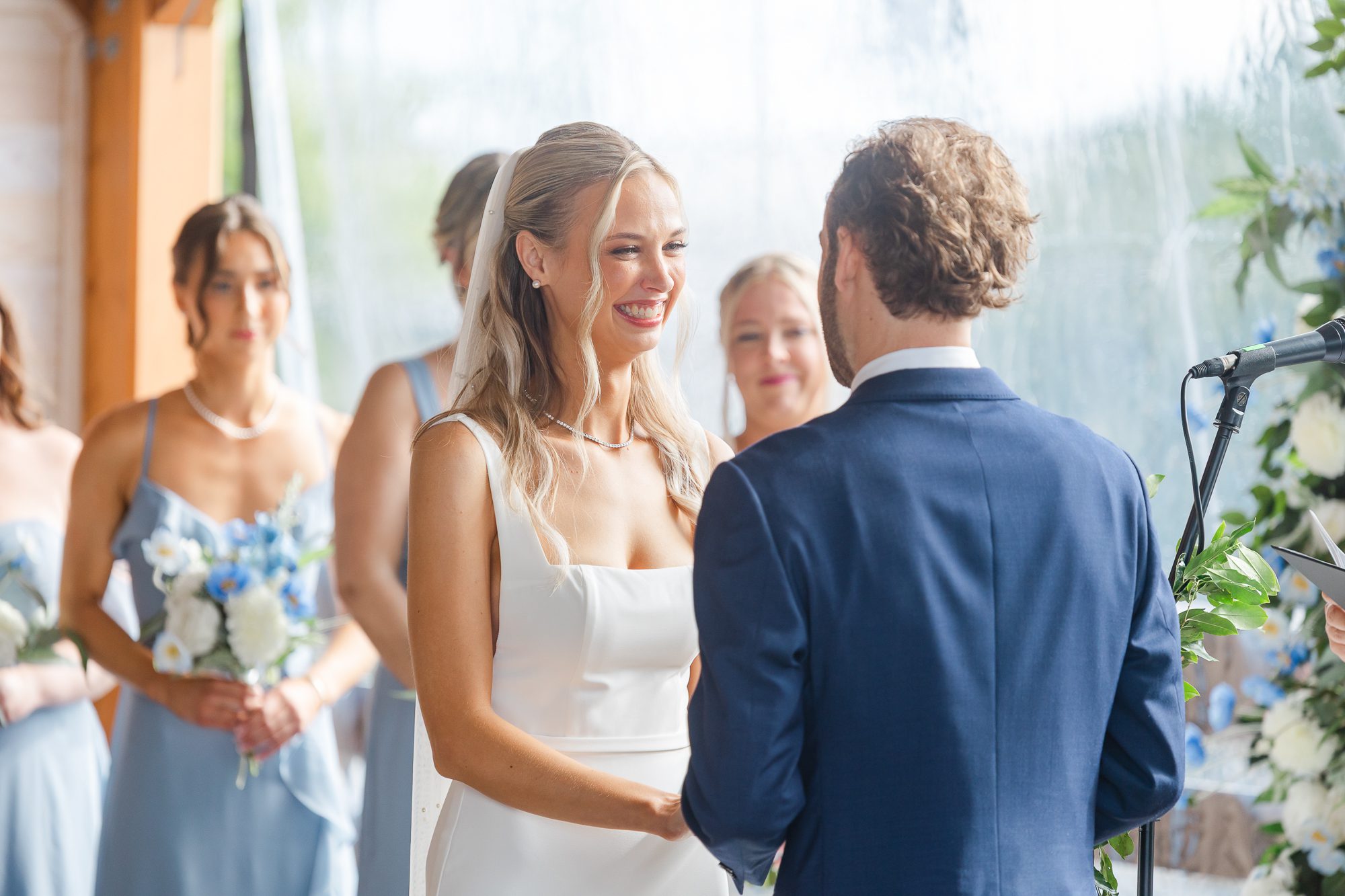 Couple exchanging vows on the riverfront deck at 128 South in Wilmington NC