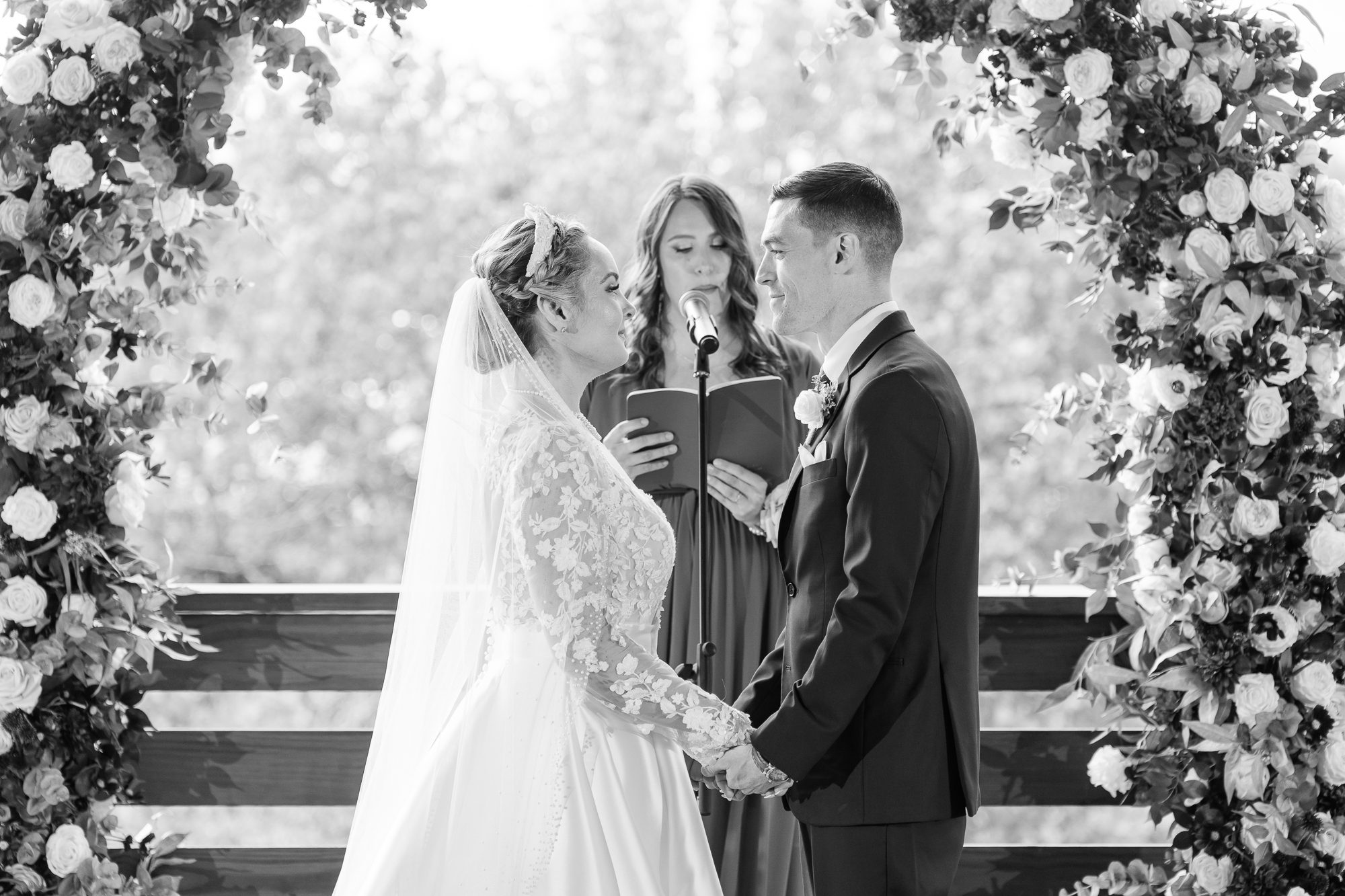 Ceremony setup on the 128 South balcony with river views and natural light
