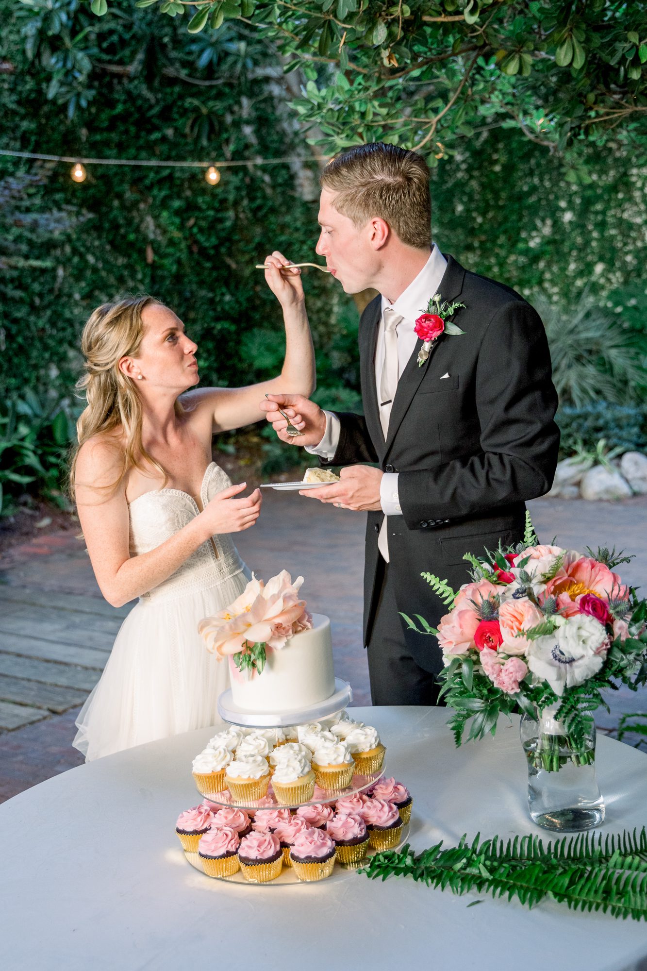 Bride and groom cutting their wedding cake at The Atrium 