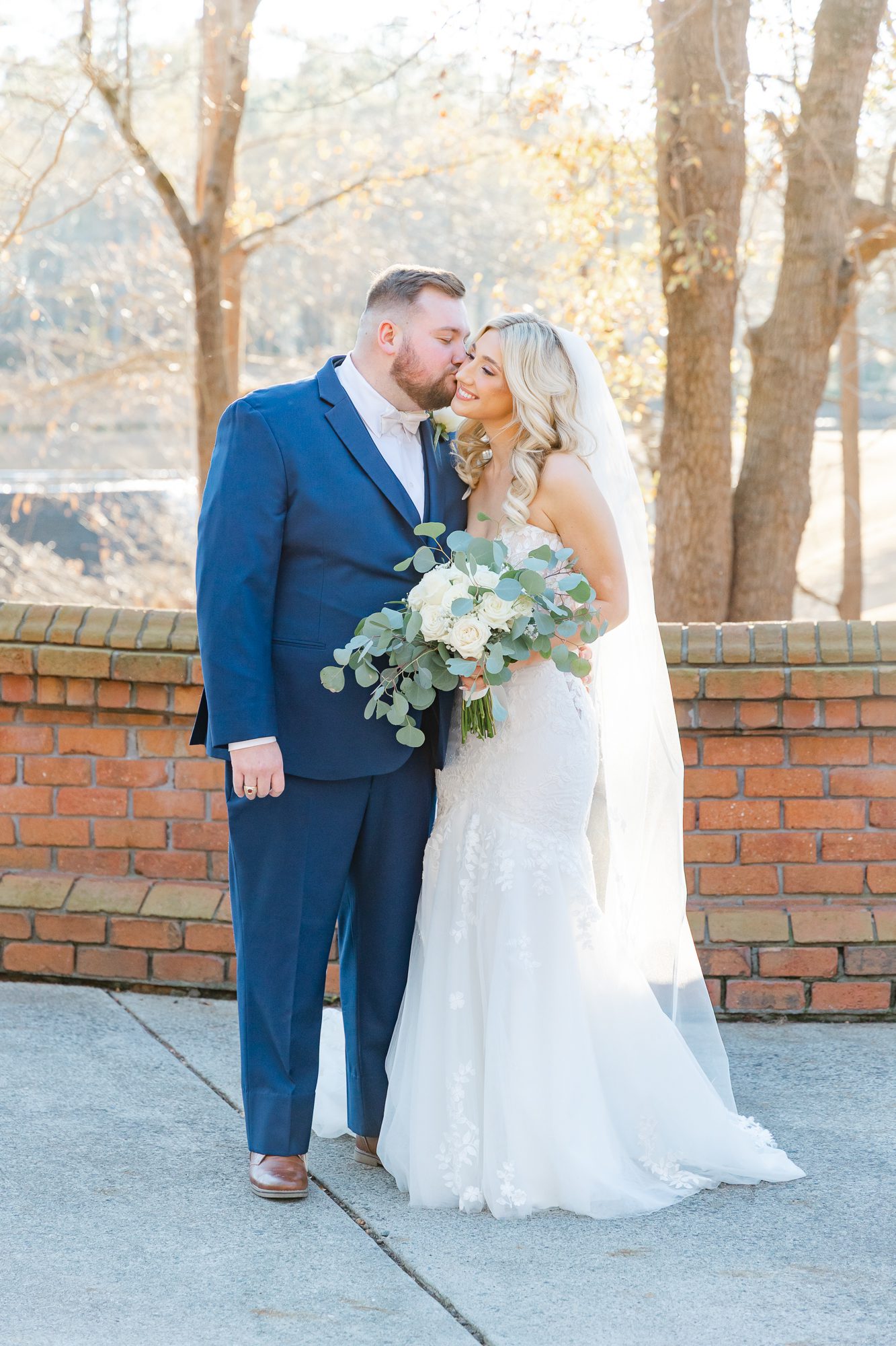 Romantic couple portrait among the trees at River Landing in North Carolina