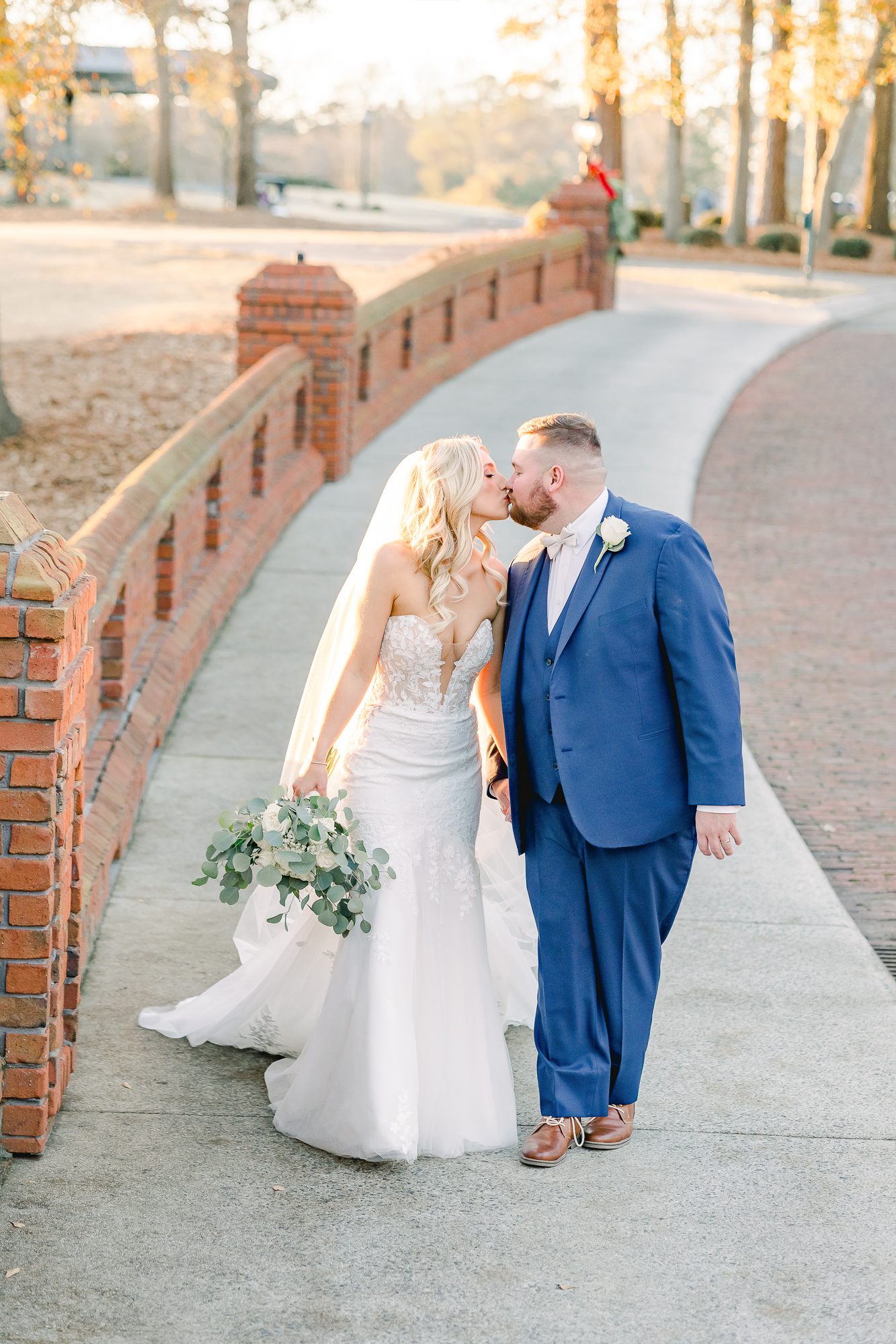 Classic River Landing wedding photography featuring the couple on the bridge